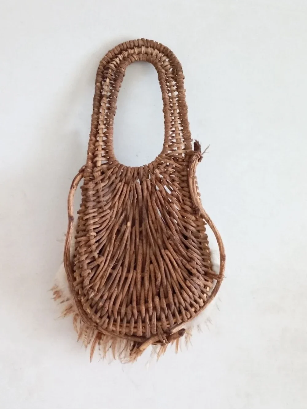 Indigenous Native American vintage natural wicker and feather wall basket